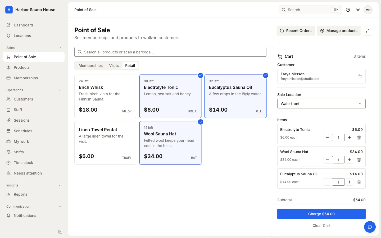 Point of sale with three retail items in the cart for a named customer, ready to charge $54.00